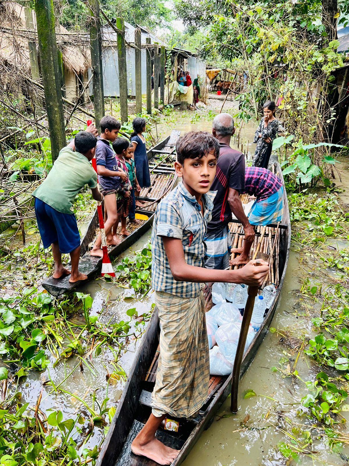People working together in a flooded community during an emergency response